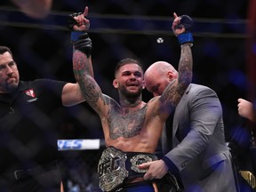 Cody Garbrandt reacts to his victory over Dominick Cruz in their UFC bantamweight championship bout at UFC 207.