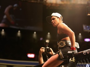 Amanda Nunes of Brazil reacts to her victory over Ronda Rousey in their UFC women's bantamweight championship bout during the UFC 207 event on December 30, 2016 in Las Vegas, Nevada.