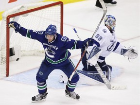 Vancouver Canucks' Bo Horvat (53) celebrates his goal against Tampa Bay Lightning's goaltender Andrei Vasilevskiy (88) during third period NHL hockey action against the Vancouver Canucks, in Vancouver on Friday, December 16, 2016.