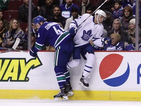 Vancouver Canucks' Erik Gudbranson checks Toronto Maple Leafs' Nazem Kadri during first-period action at The Rog Saturday night. At just 24, Gudbranson seems to be a grizzled vet on the Canucks.