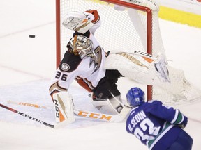 Vancouver Canucks' Henrik Sedin (33) scores the game-winning goal against Anaheim Ducks' goaltender John Gibson (36) during overtime NHL hockey action in Vancouver on Friday, December 30, 2016.