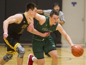 Walnut Grove's Ty Rowell (right) is guarded by Kelowna's Mason Bourcier on Saturday in the final of the Tsumura Basketball Invitational in Langley.