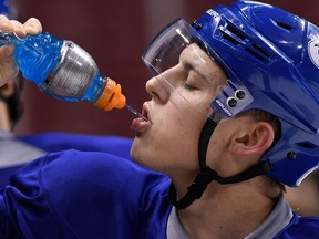 Vancouver Canucks Troy Stecher replenishes his electrolytes during practice, something he had to do on a frequent basis during training camp, thanks to his otherworldly work ethic.