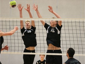 Walnut Grove's Brett Christensen, left, and Andrew Goertzen make an imposing wall at the net during Thursday's B.C. senior boys volleyball triple-A game against the Delta Pacers at the Langley Events Centre.