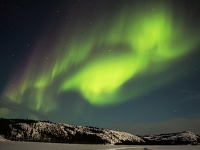 Aurora lights in the Yukon night sky.