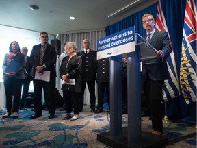 B.C. Health Minister Terry Lake, right, speaks about the overdose crisis of deaths involving fentanyl-laced drugs in Vancouver on Sept. 21, 2016. — THE CANADIAN PRESS files