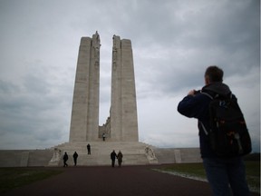 Visitors walk towards the Canadian National Vimy Memorial in France.