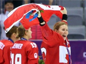 SOCHI: FEBRUARY 20, 2014 -- Hayley Wickenheiser of Canada enjoys the moment as her team celebrates their gold medal performance after beating the USA in overtime in the women's hockey event at the Sochi 2014 Olympic Games, February 20, 2014. Photo by Jean Levac/Postmedia News