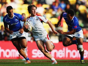 WELLINGTON, NEW ZEALAND - FEBRUARY 07: Lucas Hammond of Canada charges forward during the Shield Final match between Samoa and Canada in the 2015 Wellington Sevens at Westpac Stadium on February 7, 2015 in Wellington, New Zealand.