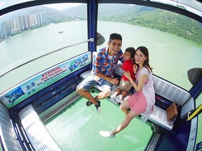 The Ngong Ping 360 cable car with glass floor offers spectaculr views on the way to see the Big Buddha.