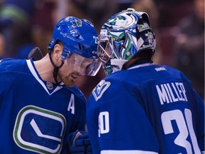 VANCOUVER, BC - NOVEMBER 21: Daniel Sedin #22 of the Vancouver Canucks congratulates goalie Ryan Miller #30 after defeating the Chicago Blackhawks 6-3 in NHL action on November, 21, 2015 at Rogers Arena in Vancouver, British Columbia, Canada.