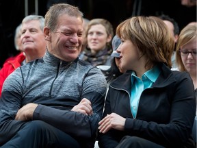 Lululemon founder Chip Wilson, left, shares a laugh with B.C. Premier Christy Clark during an announcement at Kwantlen Polytechnic University in Richmond, B.C., on Friday December 7, 2012. Wilson is a big B.C. Liberals donor.