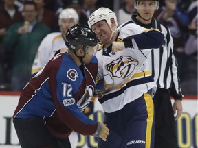 Nashville Predators winger Cody McLeod throws a punch at former Colorado Avalanche teammate Jarome Iginla on Saturday. McLeod and Preds take on the Canucks at Rogers Arena on Tuesday night.