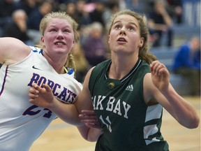 Oak Bay's Sophie de Goede, right, battles for a rebound against Brookswood's Brooklyn Golt during the Centennial Top 10 Shoot-Out final Saturday in Coquitlam. Gerry Kahrmann/PNG files