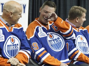 From left, Mark Messier, Wayne Gretzky and Jari Kurri share a laugh during an Oilers media availability with the members of the Stanley Cup-winning 1983-84 team at Rexall Place in Edmonton on Oct. 8, 2014. Ian Kucerak/Edmonton Sun files