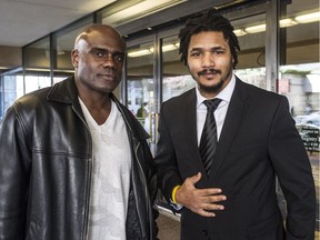 FEBRUARY 23,  2016. Former BC Lions and CFL players Arland Bruce (right) and Larry Thompson outside BC Supreme Court  in  Vancouver, B.C., on February 23, 2016.  The dispute is over concussion injuries.  (Steve Bosch  /  PNG staff photo)  00041881A [PNG Merlin Archive]
