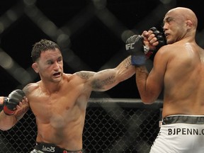 Frankie Edgar hits B.J. Penn during their featherweight bout at The Ultimate Fighter 19 Finale at Mandalay Bay in Las Vegas on July 6, 2014.
