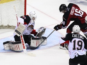 VANCOUVER, BC - OCTOBER 18: Goaltender Ty Edwards #35 of the Prince George Cougars stops Thomas Foster #16 of the Vancouver Giants during the second period of their WHL game at the Pacific Coliseum on October 18, 2014 in Vancouver, British Columbia, Canada. (Photo by Ben Nelms/Getty Images)