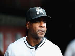 Barry Bonds, then hitting coach of the Miami Marlins looks on in the dugout before a game last year. Bonds parted ways with the Marlins in October, but he's back in the baseball spotlight again due to the Hall of Fame balloting.