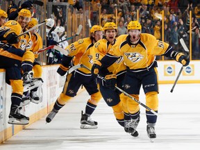 Austin Watson, Filip Forsberg and Mike Ribeiro of the  Predators celebrate their overtime win.