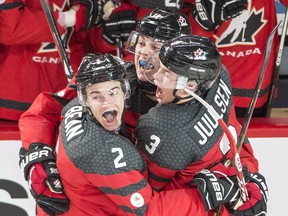 Canada's Jake Bean (2) Dylan Strome (19) and Noah Juulsen (3) celebrate a goal against Sweden during IIHF World Junior Championships semifinal action Jan. 4, 2017, in Montreal.