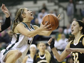 Wisconsin Green Bay guard Kaili Lukan drives to the basket in an NCAA college basketball game against Wisconsin Milwaukee of the Horizon League championship in Green Bay, Wis., Sunday, March 13, 2016. Sisters Megan and Kaili Lukan, who played basketball together at the University of Wisconsin???Green Bay, are on the verge of a sporting reunion, this time with the Canadian women's rugby sevens team.