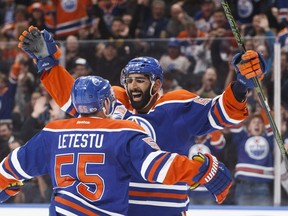 Edmonton Oilers' Mark Letestu (55) and Jujhar Khaira (54) celebrate a goal against the Arizona Coyotes during second period NHL action in Edmonton, Alta., on Monday January 16, 2017.