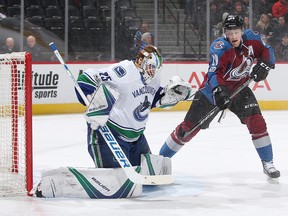 Jacob Markstrom makes a glove save against Nathan MacKinnon.