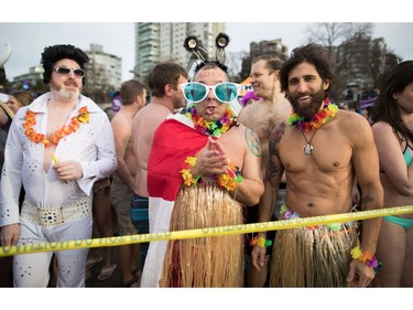 People wait to participate in the Polar Bear Swim in Vancouver, B.C., on Sunday, January 1, 2017. The event, hosted by the Vancouver Polar Bear Swim Club, was first held on new year's day in 1920.