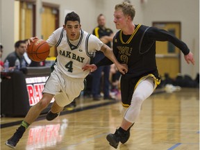 Oak Bay's Jaden Touchie (left) drives past Kelowna's Parker Simson in the 2016 Legal Beagle championship final last January in Port Coquitlam. (PNG photo by Gerry Kahrmann)