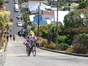 Rudy Pospisil climbs Baldwin Street in Dunedin, New Zealand, during his world-record-setting ride.