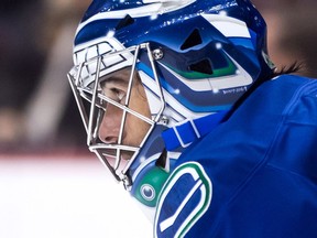 Canucks goalie Ryan Miller watches the play during Vancouver's 3-2 win over Colorado on Monday, his 350th NHL victory.
