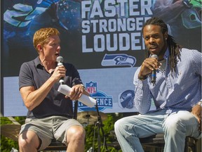 Scott Rintoul, here in 2013 interviewing Seahawk Richard Sherman, has been let go by Rogers.