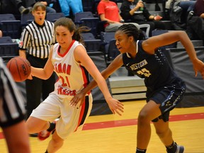 SFU's Sophie Swant (left) drives past Western Washington's Kiana Gandy during GNAC action Tuesday atop Burnaby Mountain. (Steve Frost, SFU athletics)