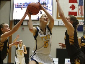 Trinity Western's Kayla Gordon brings down a rebound Friday as the Spartans topped the Manitoba Bisons 70-65, a game in which TWU set a team record with 55 rebounds. Scott Stewart/TWU athletics