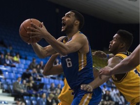 UBC Thunderbirds guard Jordan Jensen-Whyte drives to the basket Saturday against Brandon, Man., in Canada West action at War Memorial Gym. UBC completed a weekend sweep of the Bobcats and improved to 15-1 on the conference season. Richard Lam/ UBC athletics