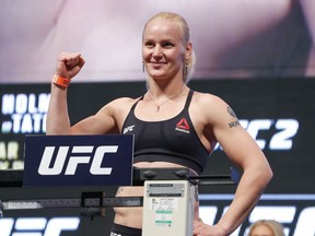 Valentina Shevchenko is all smiles on the scale in advance of her UFC 196 clash with Amanda Nunes.