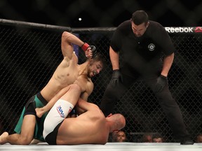 PHOENIX, AZ - JANUARY 15:  Yair Rodriguez (R) throws a right onto BJ Penn during the UFC Fight Night event at the at Talking Stick Resort Arena on January 15, 2017 in Phoenix, Arizona.  (Photo by Christian Petersen/Getty Images)