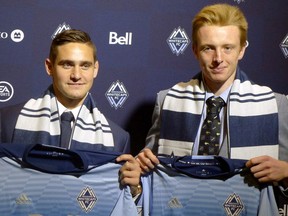 University of Connecticut's Jakob Nerwinski, left, selected 7th overall by the Vancouver Whitecaps and second round pick St. Francis University's Francis de Vries, pose at the MLS SuperDraft in Los Angeles on Friday, Jan. 13, 2017.