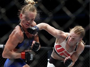 Valentina Shevchenko, right, of Kyrgyzstan, throws a punch at Holly Holm during a women's bantamweight mixed martial arts bout in Chicago in July. This weekend Shevchenko will face Julianna Pena in Denver with the winner all but guaranteed a title shot.