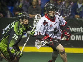 VANCOUVER, BC - APRIL 23, 2016, - Vancouver Stealth   Rhys Duch gets by Saskatchewan Rush Adrian Sorichetti in National Lacrosse League action at the Langley Event Centre in Langley, BC. April 23, 2016. (Arlen Redekop / PNG photo) (story by Steve Ewen) 00042903B [PNG Merlin Archive]