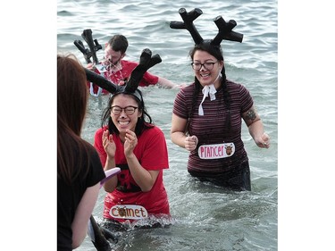 New Years' day revellers enjoy the annual Polar Bear Swim at English Bay