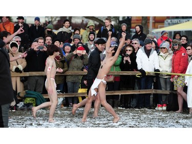 New Years' day revellers enjoy the annual Polar Bear Swim at English Bay