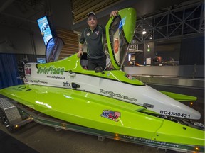 Mike McLellan stands inside the McLellan F1 Formula 1 Tunnel Racing boat at the 54th Vancouver International Boat Show at B.C. Place.