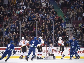 Vancouver Canucks centre Michael Chaput (45) celebrates his goal past Calgary Flames goalie Brian Elliott (1) during first period NHL action in Vancouver, B.C. Friday, Jan. 6, 2017.