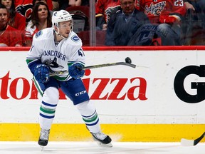 CALGARY, AB - APRIL 25: Sven Baertschi #47 the Vancouver Canucks gains control of the puck in mid-air during the game against the Calgary Flames at Scotiabank Saddledome for Game Six of the Western Quarterfinals during the 2015 NHL Stanley Cup Playoffs on April 25, 2015 in Calgary, Alberta, Canada.