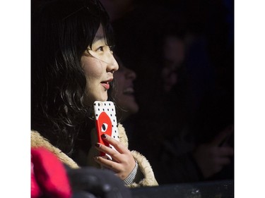 New Year's Eve revellers watch Crystal Shawanda perform on one of the two outdoor stages at Concord's New Year's Eve Vancouver Celebration, held at Canada Place on Dec. 31, 2016.