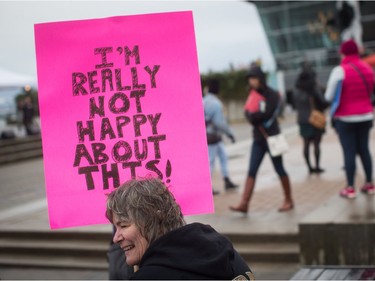 A woman holds a sign during a women's march and protest against U.S. President Donald Trump, in Vancouver, B.C., on Saturday January 21, 2017. Protests are being held across Canada today in support of the Women's March on Washington. Organizers say 30 events in all have been organized across Canada, including Ottawa, Toronto, Montreal and Vancouver.