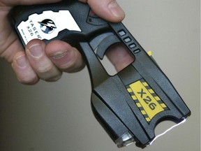 A police officer displays the Taser X26, the model in use by the Winnipeg Police Service in 2007. You don't hear much news about the devices lately, though.