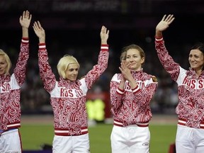 FILE - In this Aug. 11, 2012 file photo Russia&#039;s Yulia Gushchina, Antonina Krivoshapka, Tatyana Firova and Natalya Antyukh react before receiving their silver medals for the women&#039;s 4x400-meter during the athletics in the Olympic Stadium at the 2012 Summer Olympics, London. The IOC said Wednesday, Feb. 1, 2017 it has stripped Russia of an Olympic silver medal from the women&#039;s 4x400-meter relay at the 2012 London Games for doping. The IOC says Antonina Krivoshapka tested positive for the anabolic